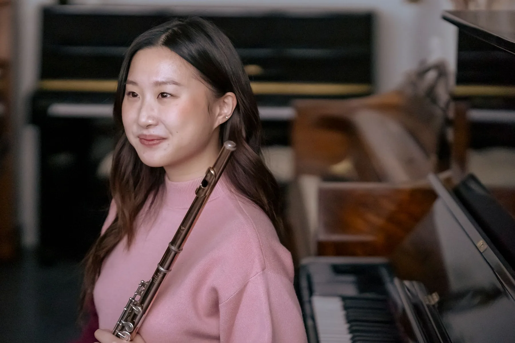 flutist in a room with a piano flutist in a room with a piano