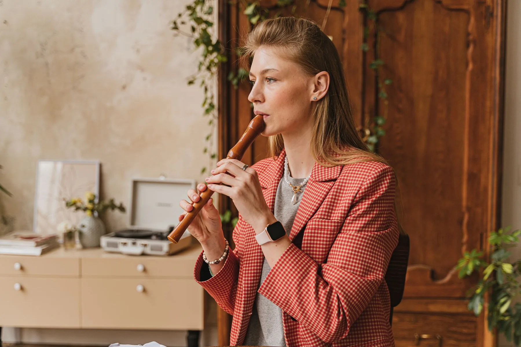 Musician playing a recorder Musician playing a recorder