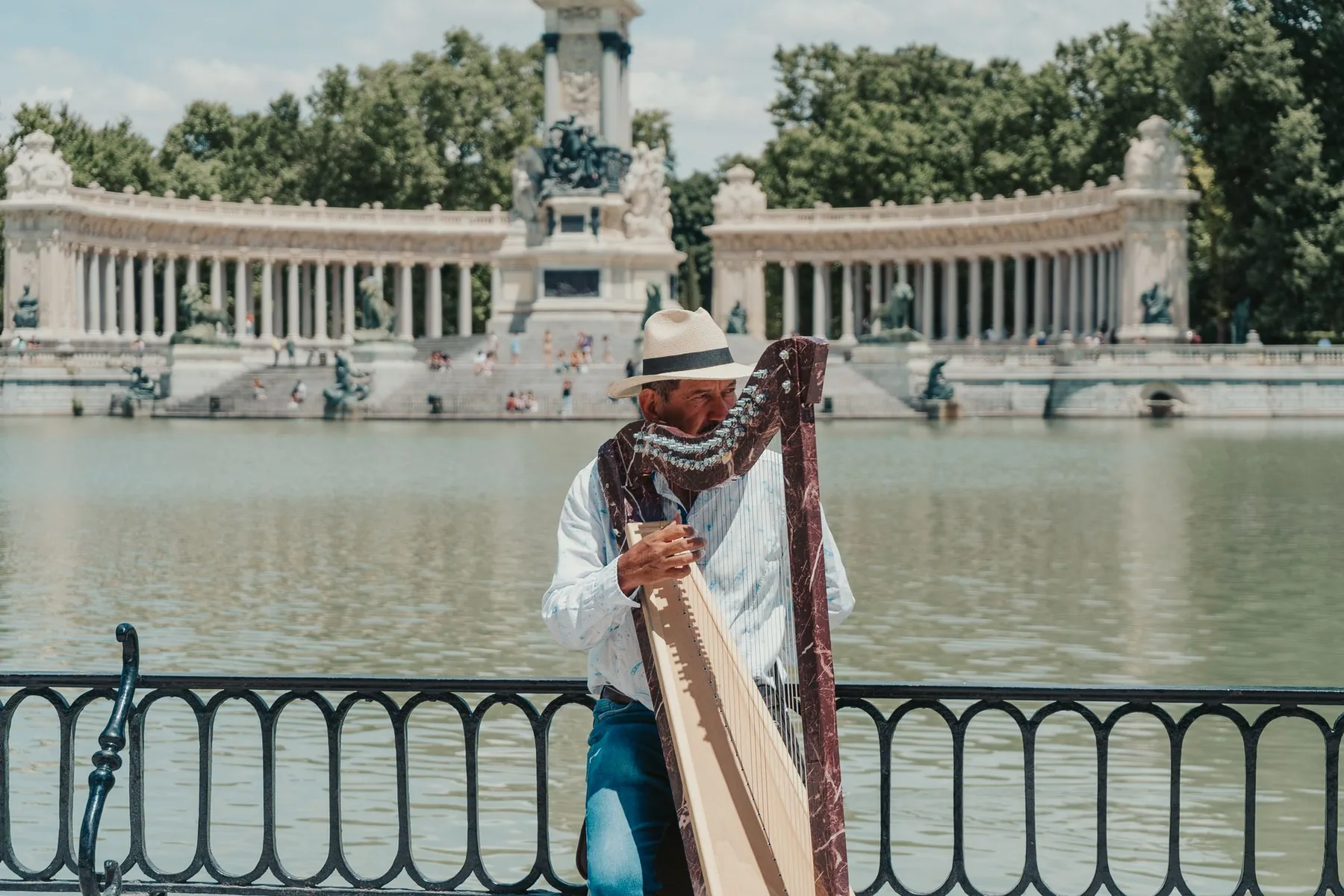 musician playing a harp outdoors musician playing a harp outdoors