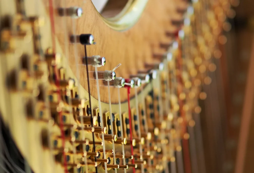 How do you change a string on a harp?