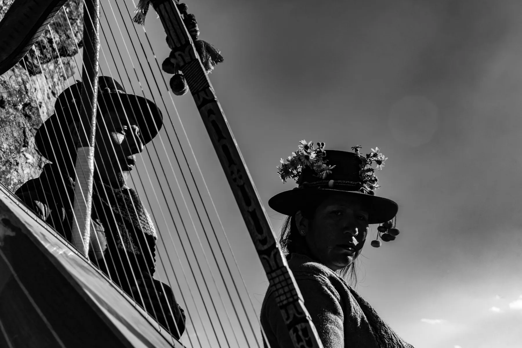 Andean musicians playing the harp