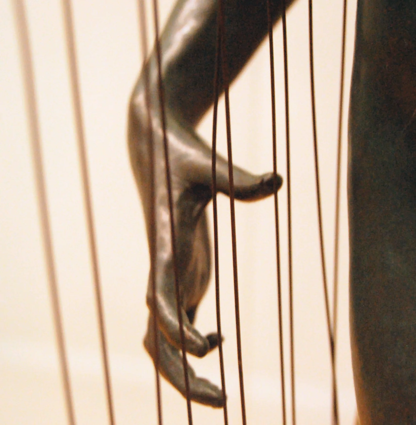 hand near harp strings