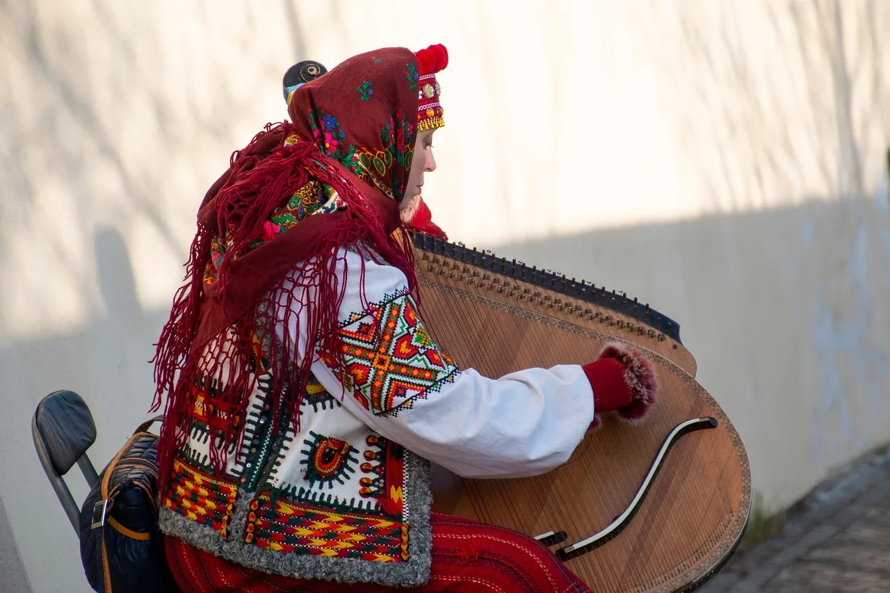 musician playing a traditional harp musician playing a traditional harp