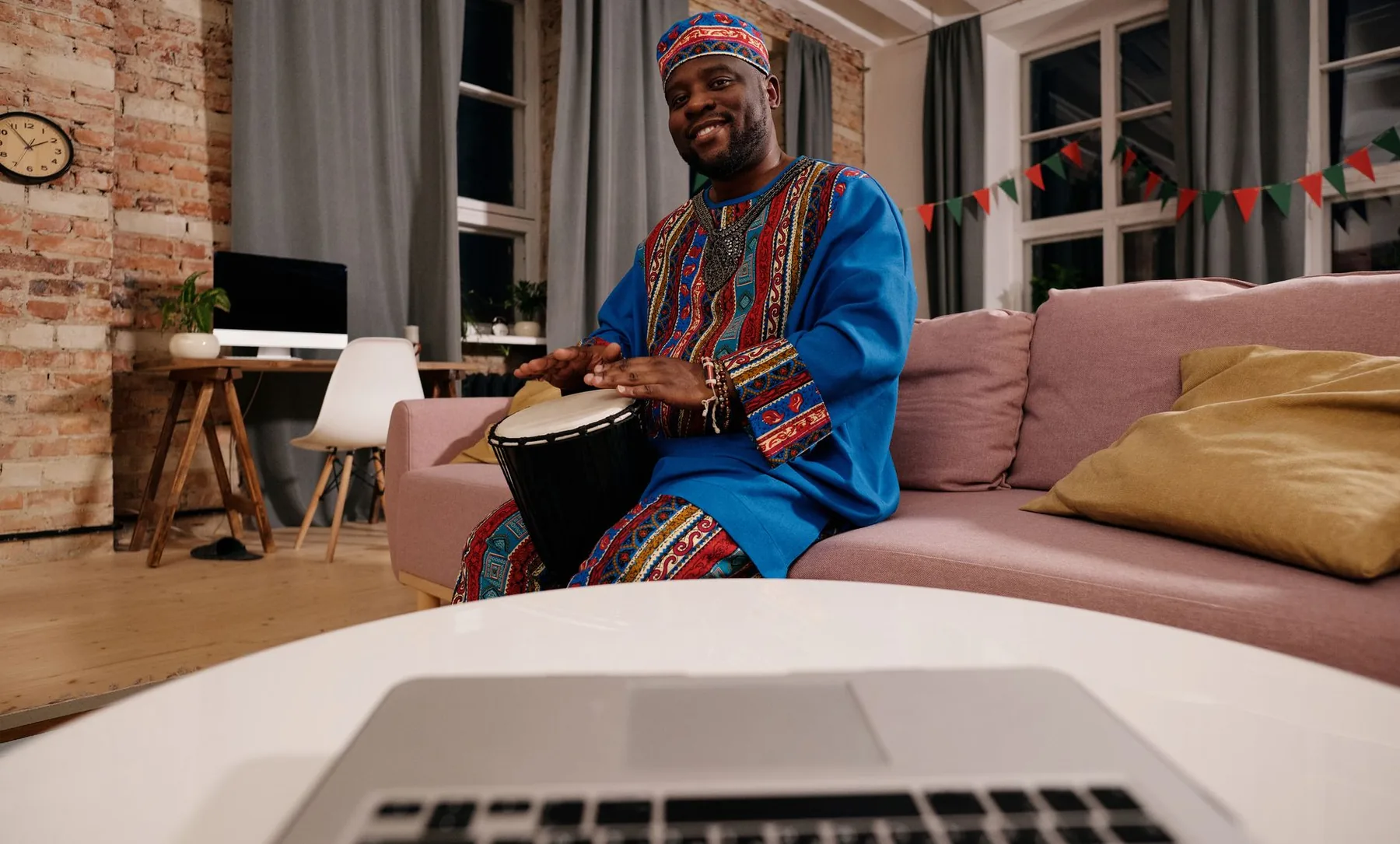 djembe player in traditional clothing djembe player in traditional clothing