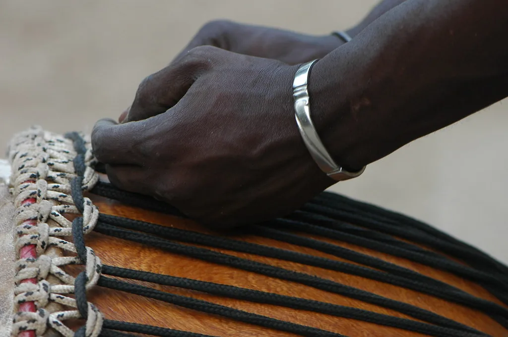 musician's hands on a djembe musician's hands on a djembe