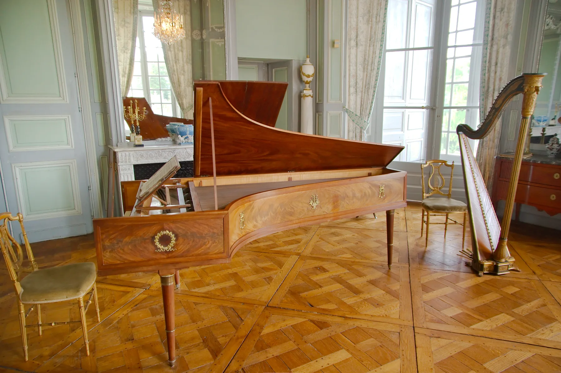 antique harp in a music room antique harp in a music room