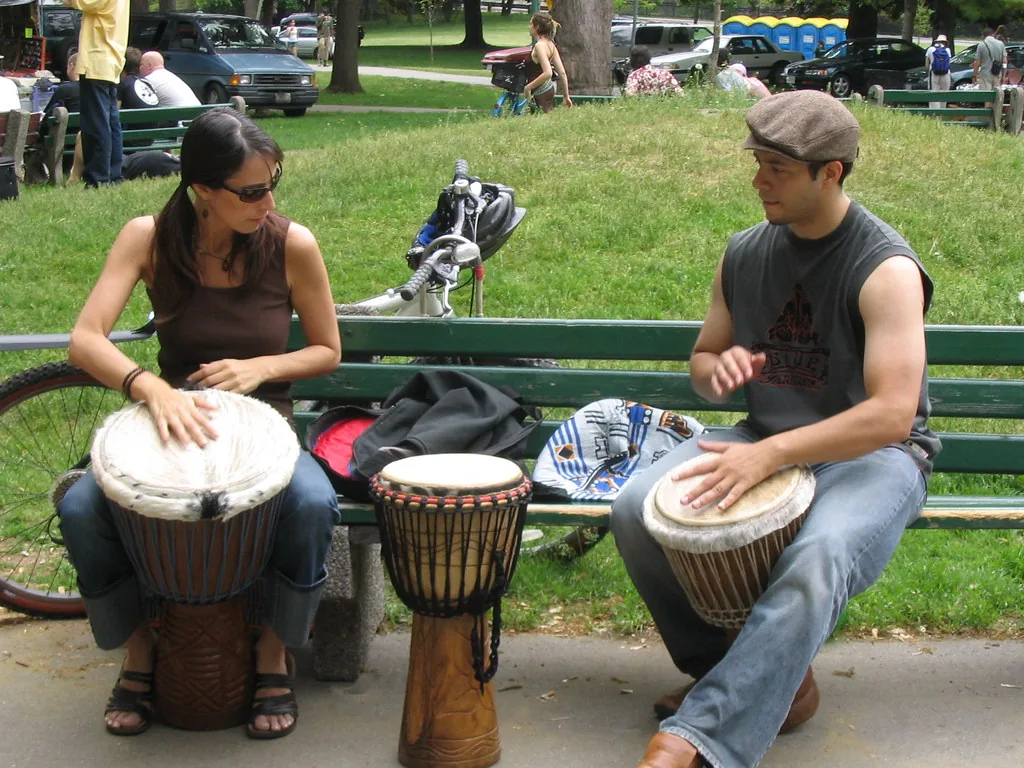 musicians playing djembe in the park musicians playing djembe in the park