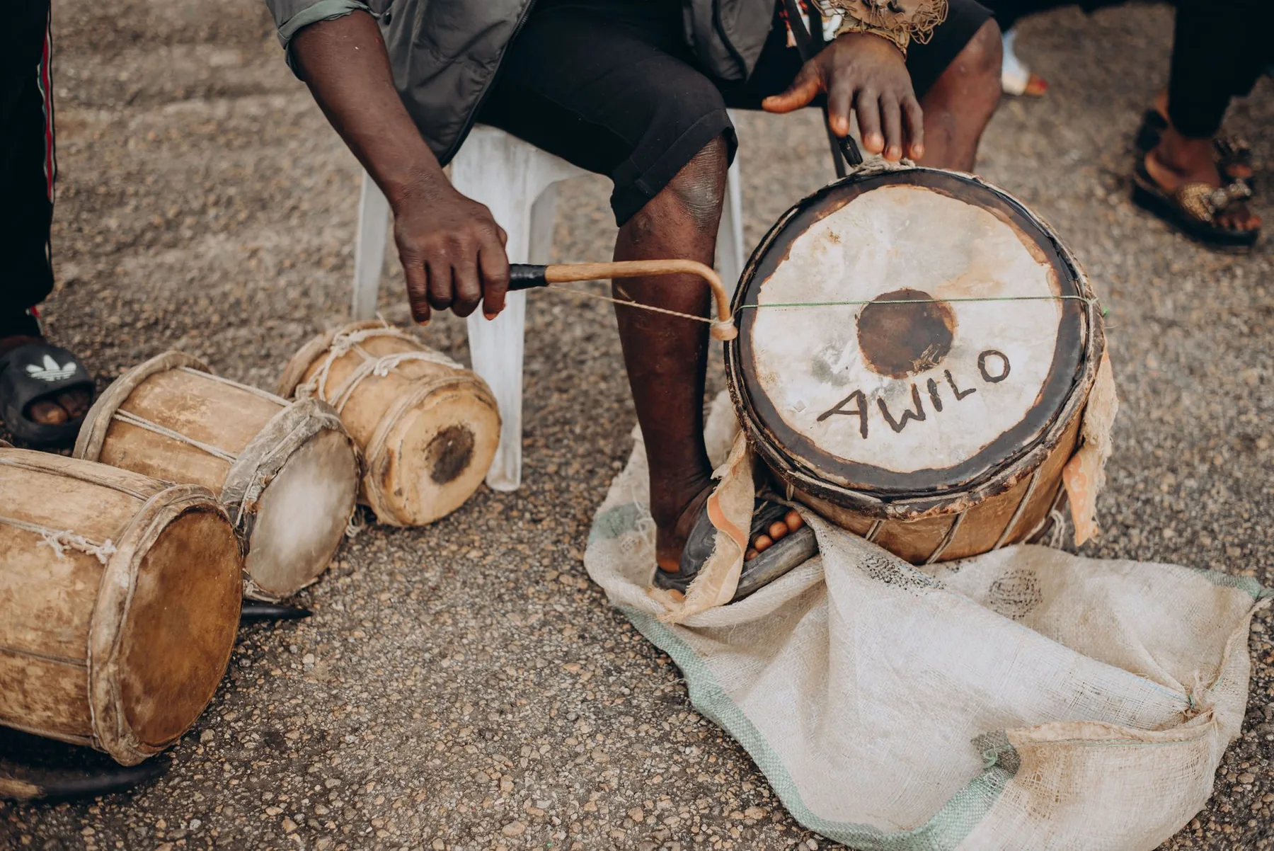 Percussionist playing African djembes Percussionist playing African djembes