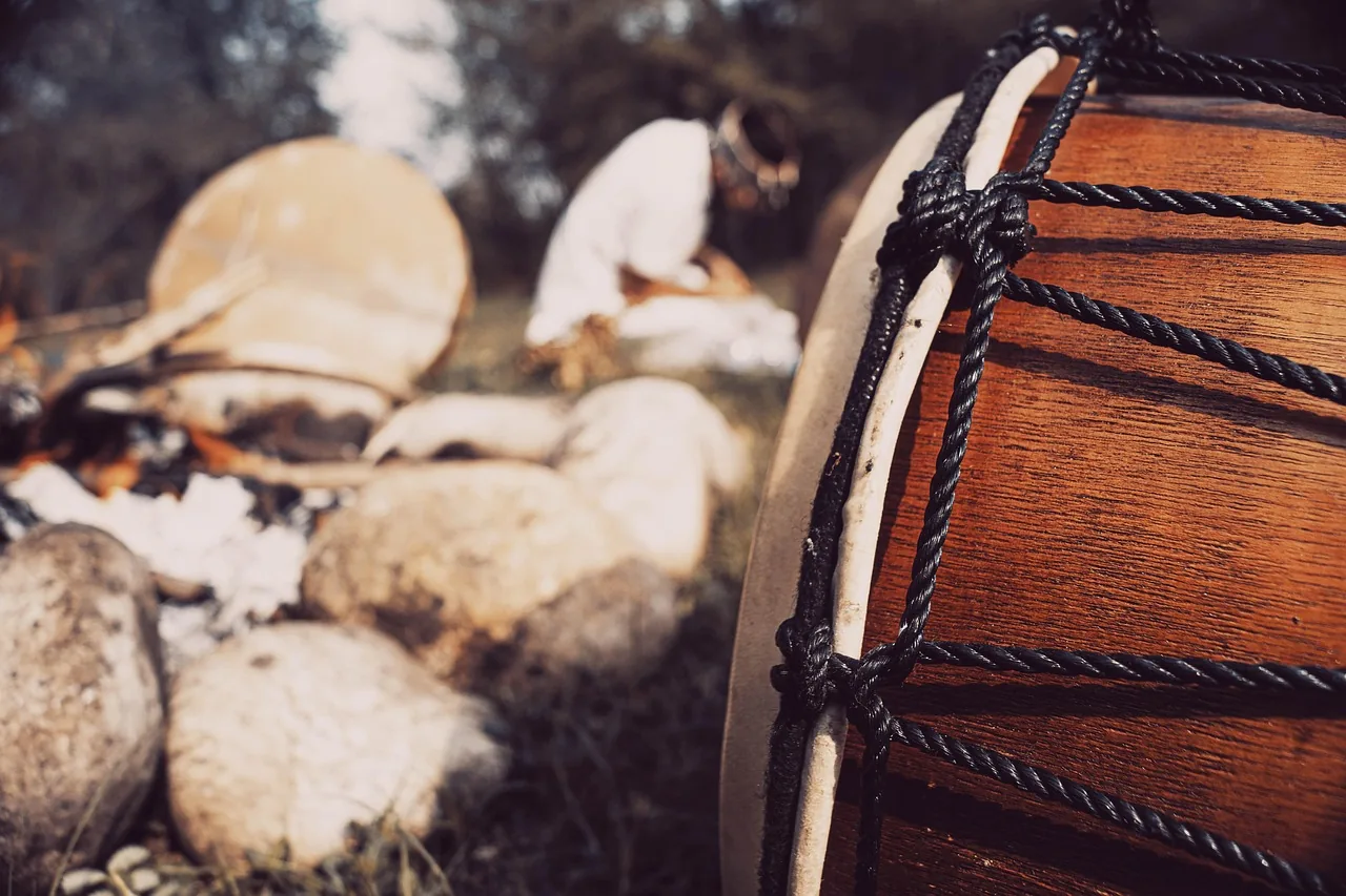 Wooden djembe with black ropework Wooden djembe with black ropework