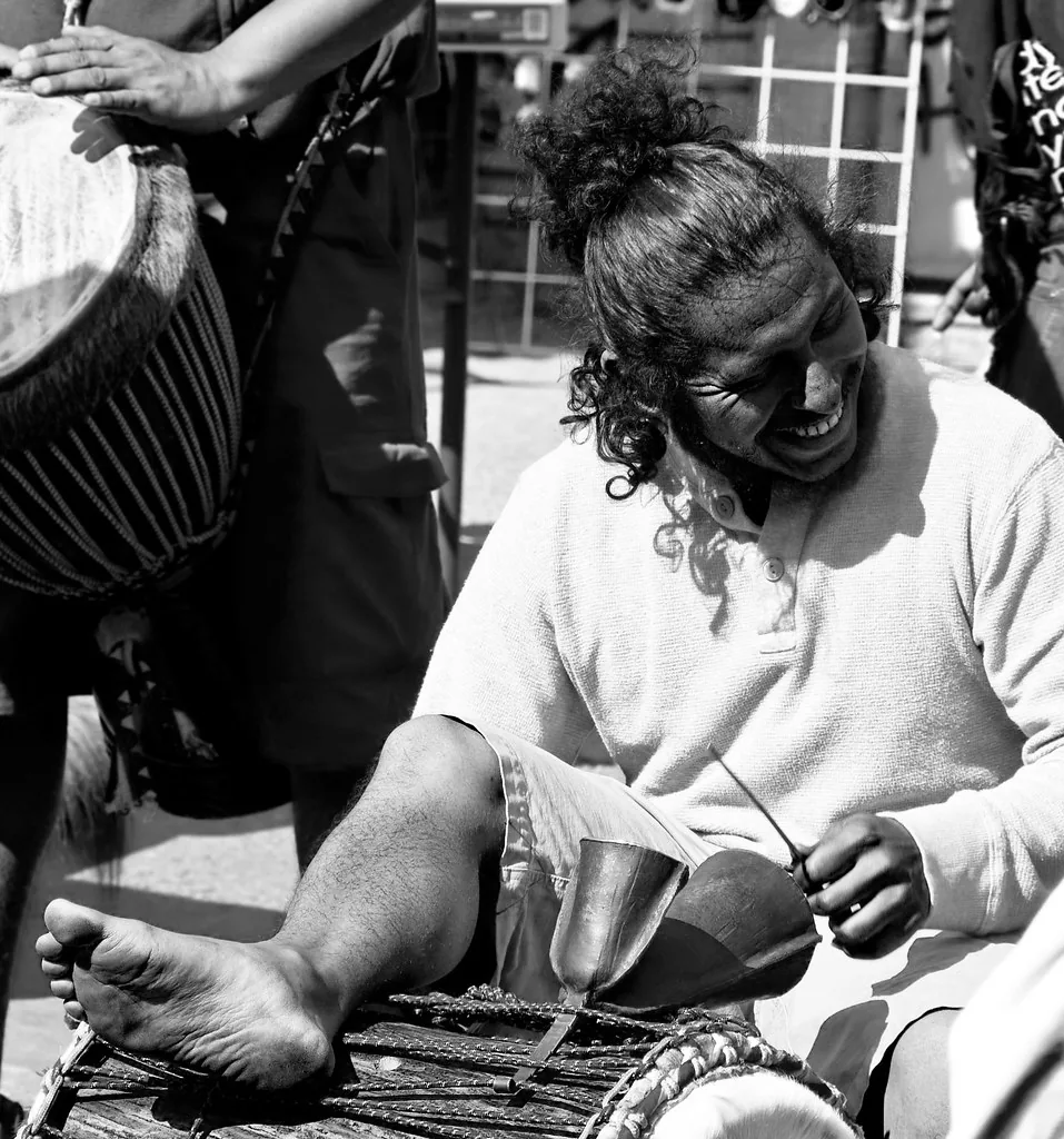 musician playing a traditional djembe