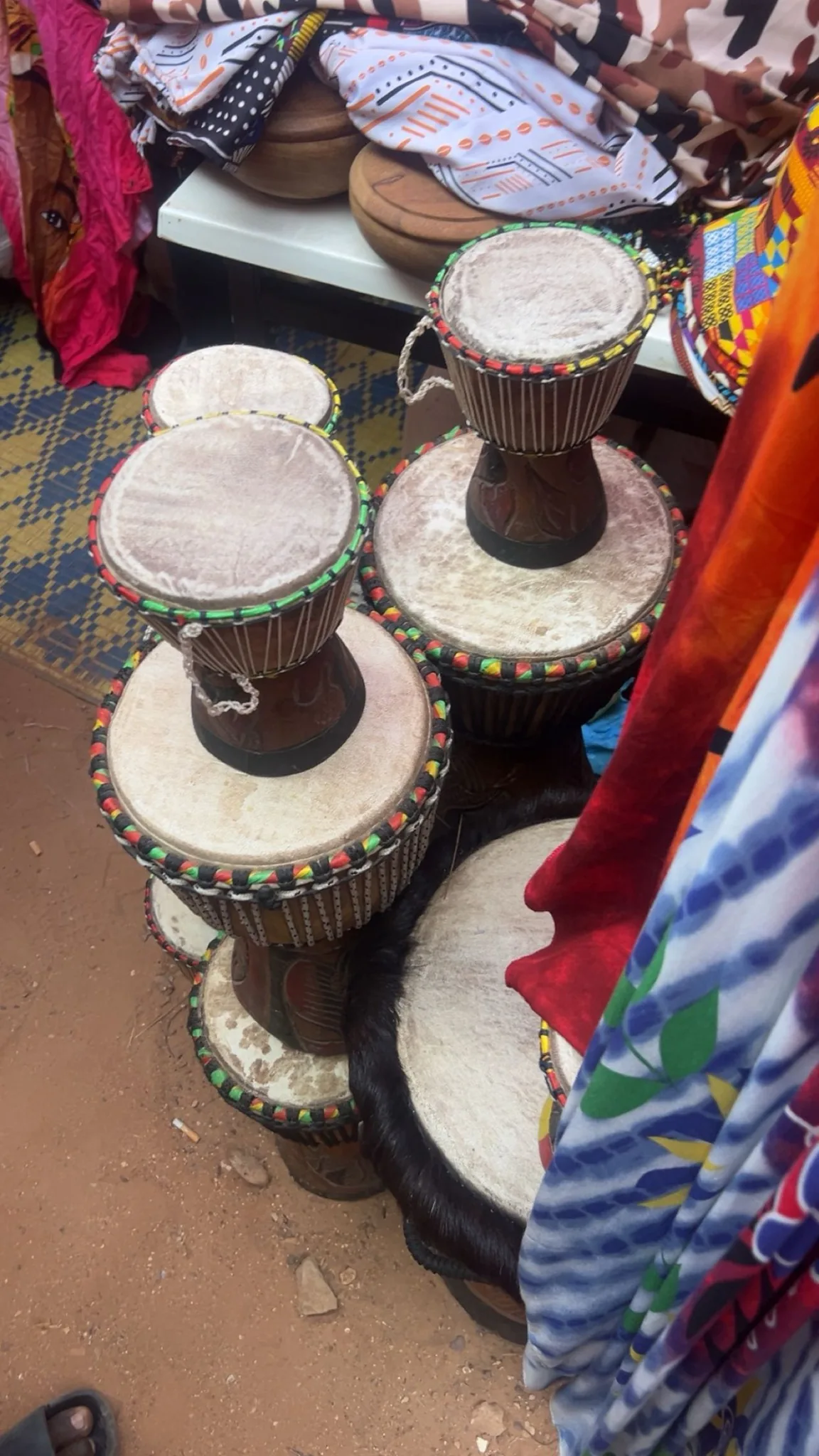 African djembes displayed in a shop African djembes displayed in a shop