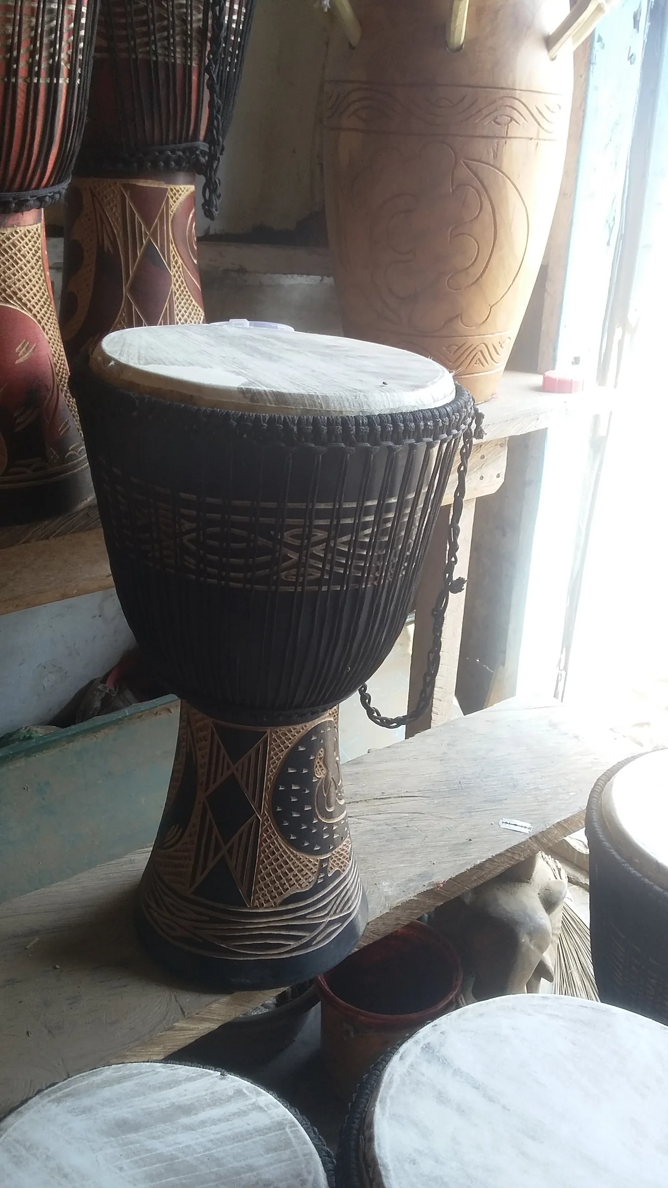close-up of handcrafted djembes close-up of handcrafted djembes