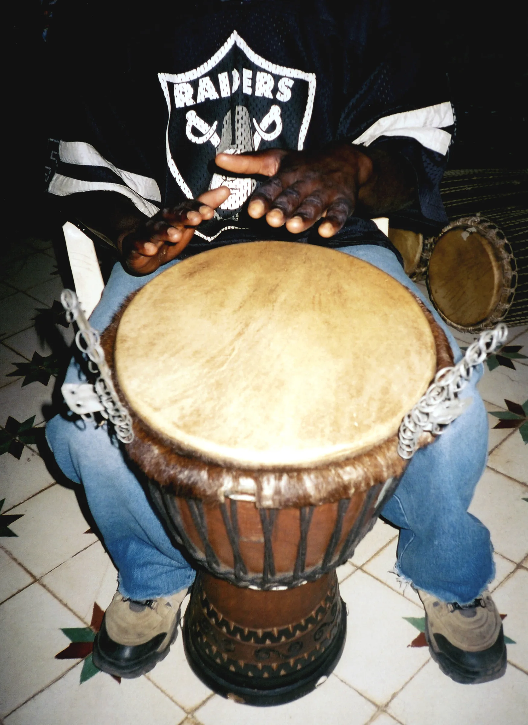 percussionist playing djembe percussionist playing djembe