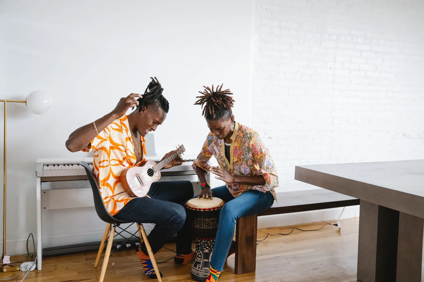 Beginners playing djembe together Beginners playing djembe together