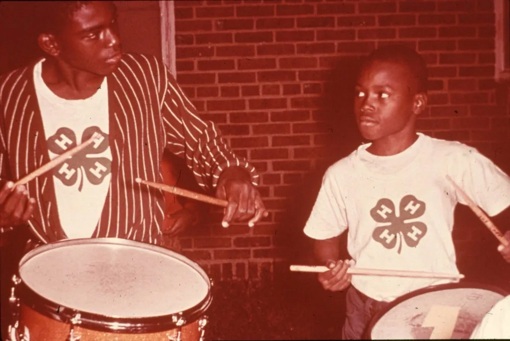 Young African percussionists playing together Young African percussionists playing together