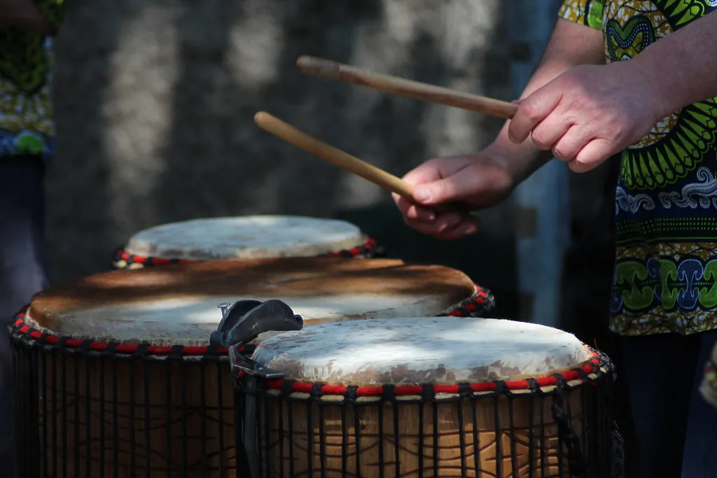 hands playing djembes hands playing djembes